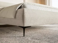 Łóżko tapicerowane 180x200 cm Roule Cord z pojemnikiem stelaż metalowy jasnobeżowe sztruks nóżki czarne