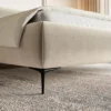 Łóżko tapicerowane 140x200 cm Roule z pojemnikiem stelaż metalowy jasnobeżowe welur hydrofobowy nóżki czarne