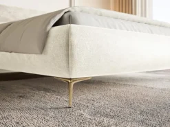 Łóżko tapicerowane 140x200 cm Roule z pojemnikiem stelaż metalowy kremowe szenil nóżki złote