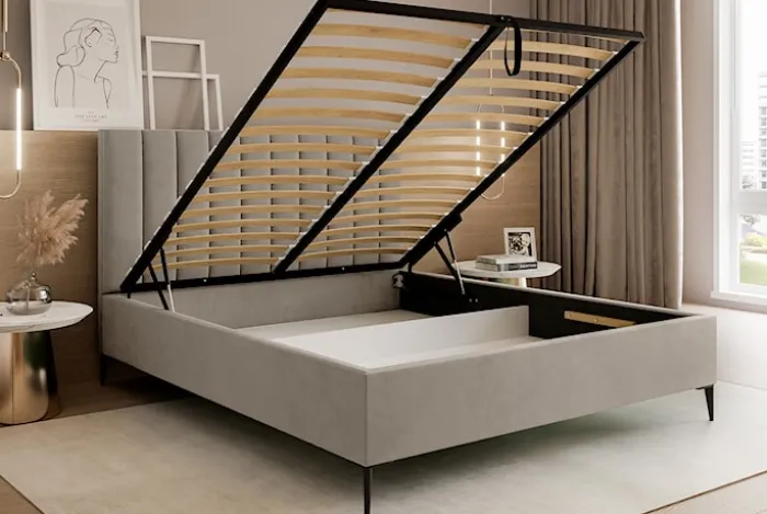 Łóżko tapicerowane 140x200 cm Veloro z pojemnikiem ciemnobeżowe welur stelaż metalowy na wysokich nóżkach