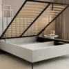 Łóżko tapicerowane 140x200 cm Veloro z pojemnikiem szarobeżowe welur stelaż metalowy na wysokich nóżkach