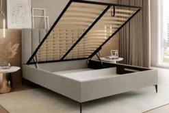 Łóżko tapicerowane 180x200 cm Veloro z pojemnikiem ciemnobeżowe welur stelaż metalowy na wysokich nóżkach