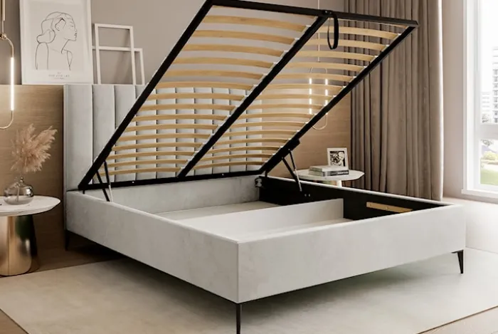 Łóżko tapicerowane 180x200 cm Veloro z pojemnikiem szarobeżowe welur stelaż metalowy na wysokich nóżkach