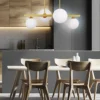 Lampa wisząca Kama x4 mosiężna z białymi kloszami