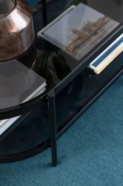 Stolik kawowy Aykal owalny z półką i szklanym blatem na metalowej podstawie 95x50 cm